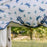 A close up of a grey pony wearing the Horseware Ireland Amigo Bug Rug Plus Pony Fly Sheet in a dragonfly print, focus on the 2 belly straps, or surcingles.