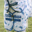 A grey pony wearing the Horseware Ireland Amigo Bug Rug Plus Pony in a dragonfly print, close up of the front closure of the fly sheet.